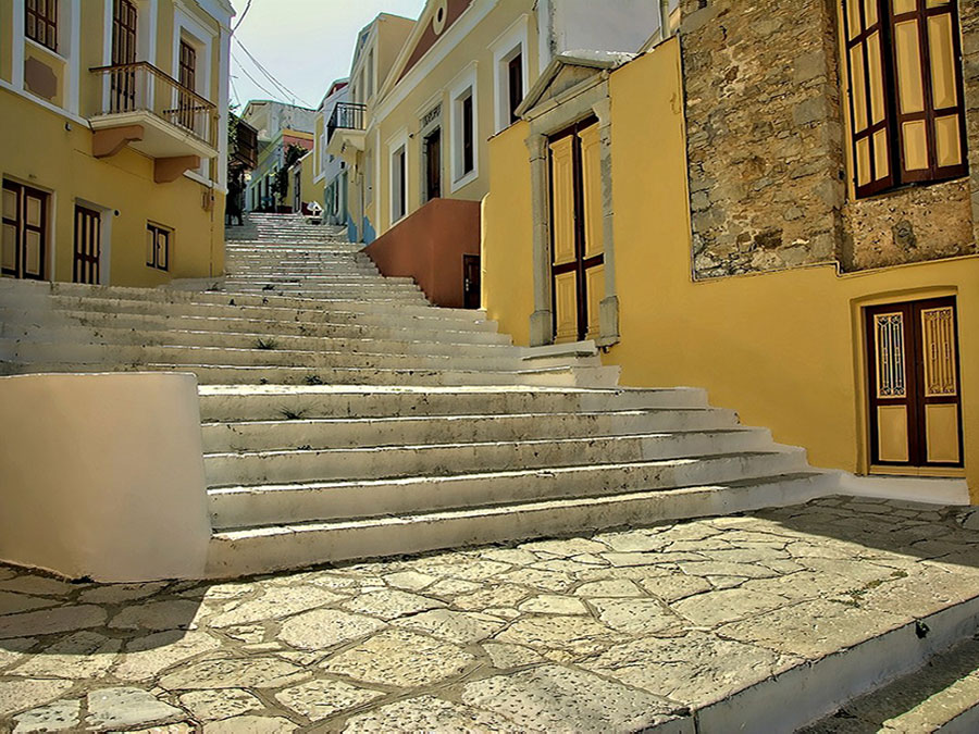 The Kali Strata stone staircase climbing from Symi harbour up to the old town of Chorio